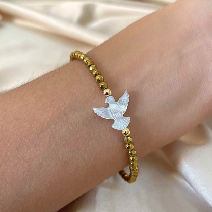 Pulseira Espírito Santo em madrepérola em Ouro 18K-750, com hematitas douradas