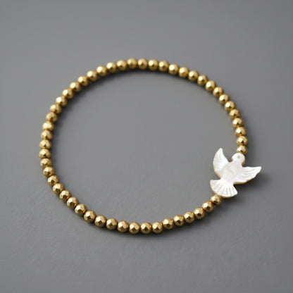 Pulseira Espírito Santo em madrepérola em Ouro 18K-750, com hematitas douradas