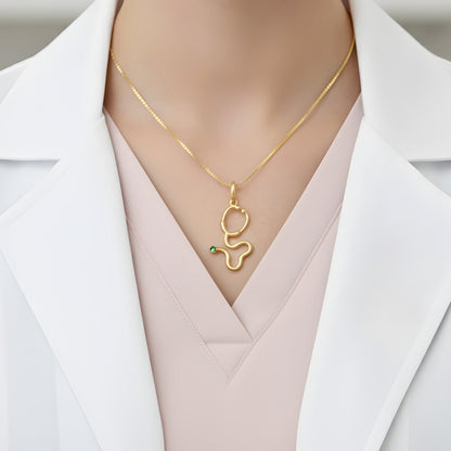 Pingente Estetoscópio em Ouro Amarelo 18K-750, com esmeralda